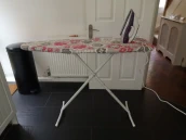 View of the iron and ironing board