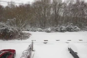 Snow-covered front garden during winter