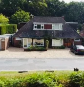 Front view of Abacus Bed and Breakfast with parking spaces