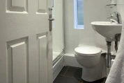 View of toilet and shower